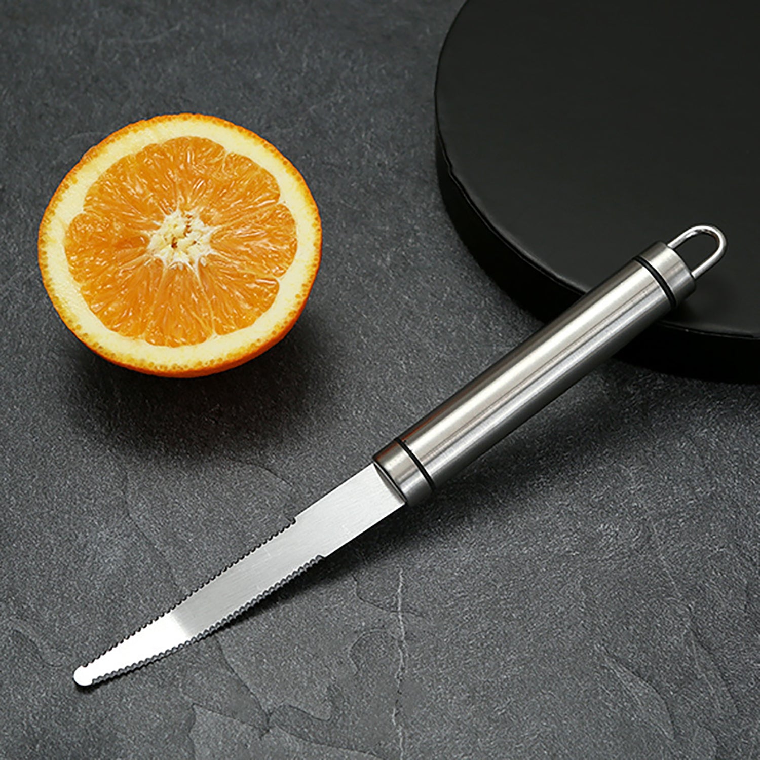 Opsticle Grapefruit trimmer, namely, a kitchen knife with serrated edges
