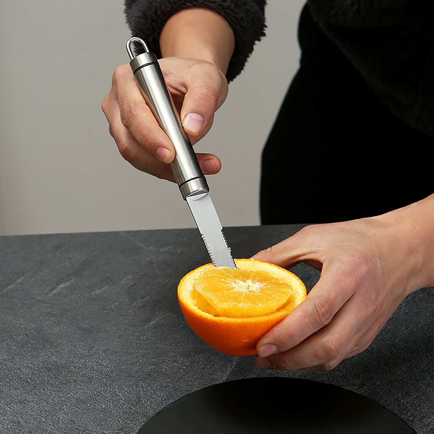 Opsticle Grapefruit trimmer, namely, a kitchen knife with serrated edges