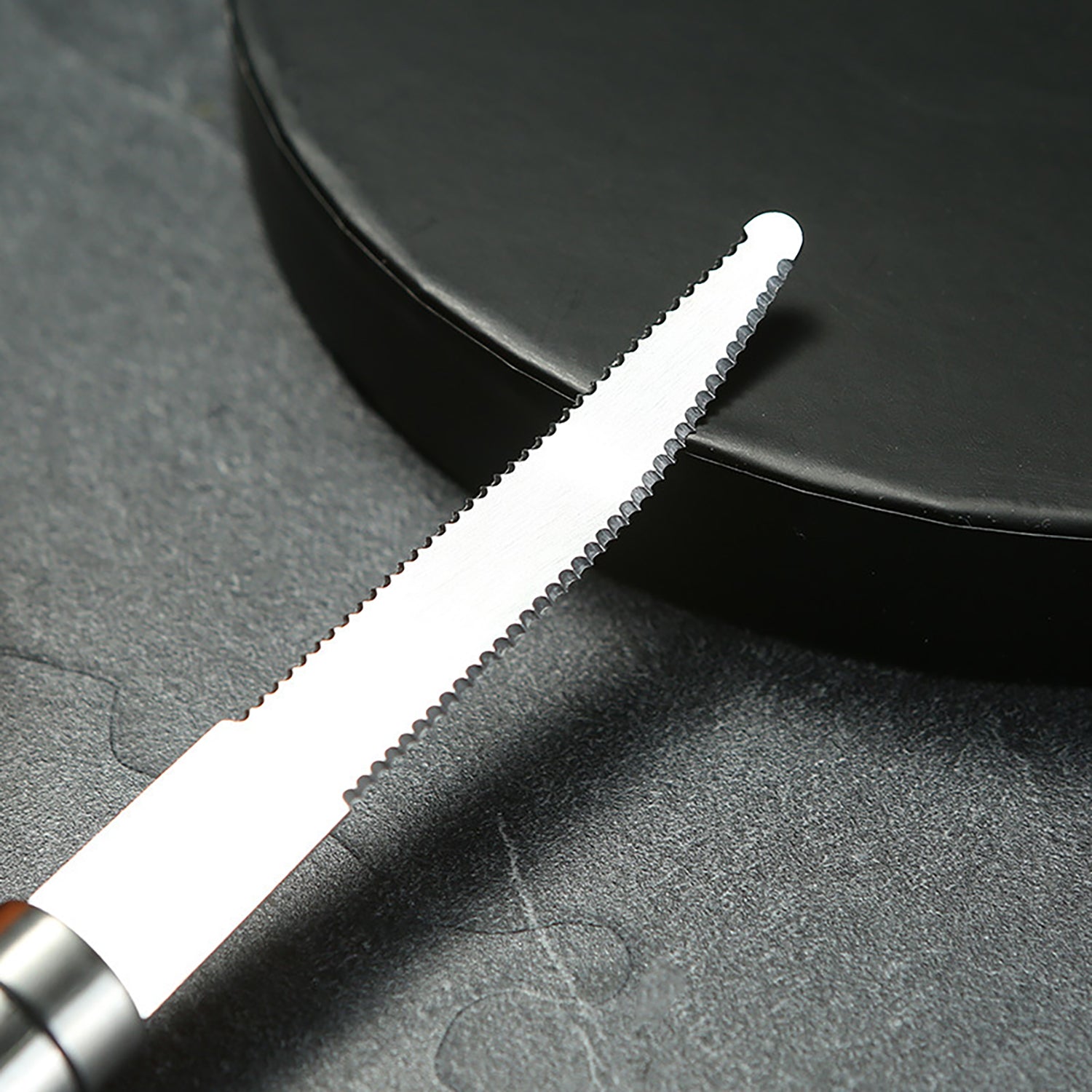 Opsticle Grapefruit trimmer, namely, a kitchen knife with serrated edges